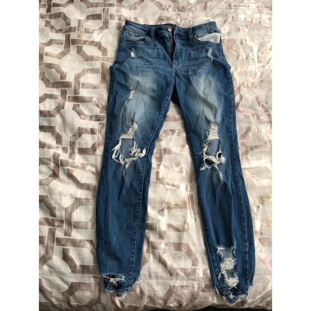 Blue denim distressed jeans